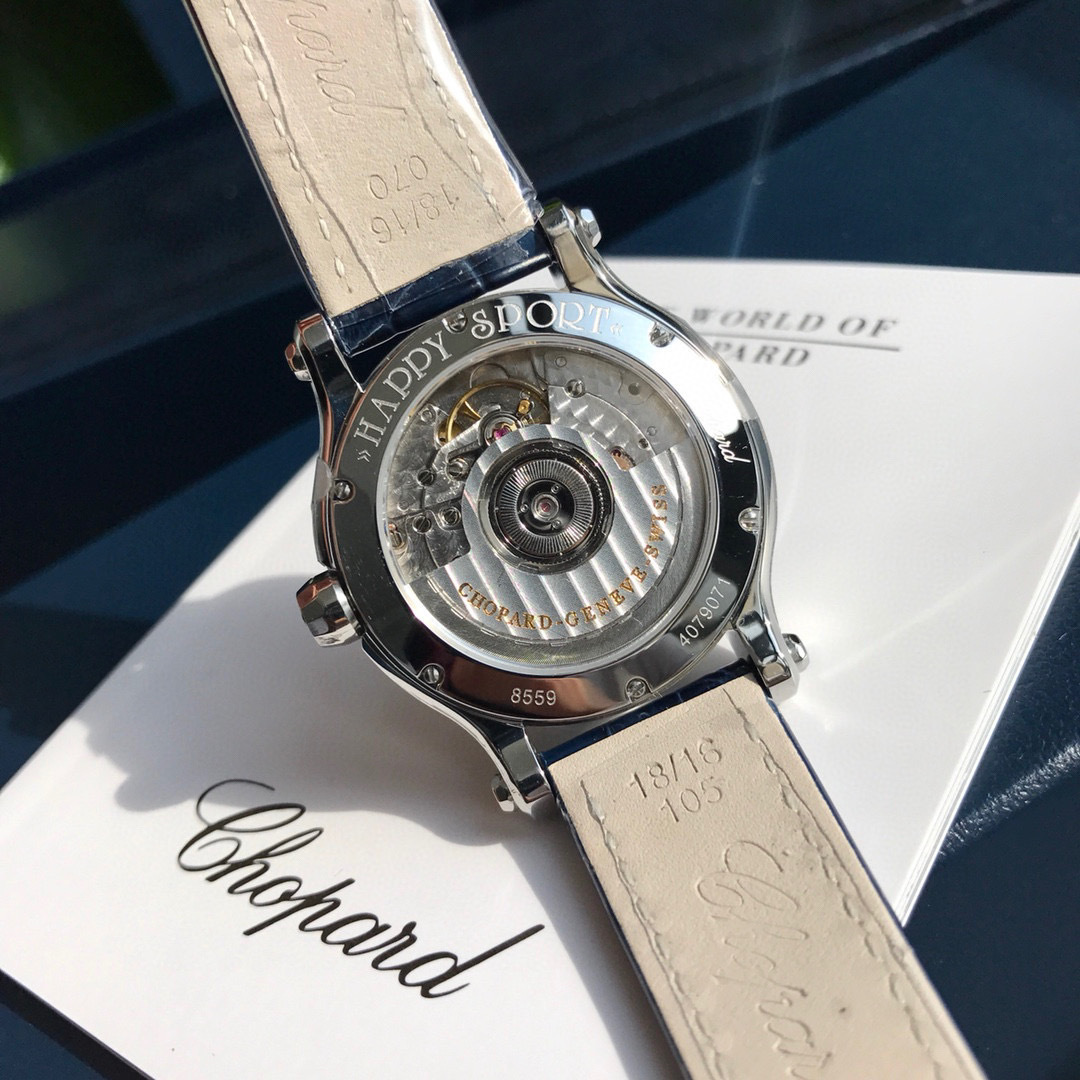 Chopard Happy Sport R. 8347 Stainless Steel, Natural Ruby Yellow & Blue Sapphire